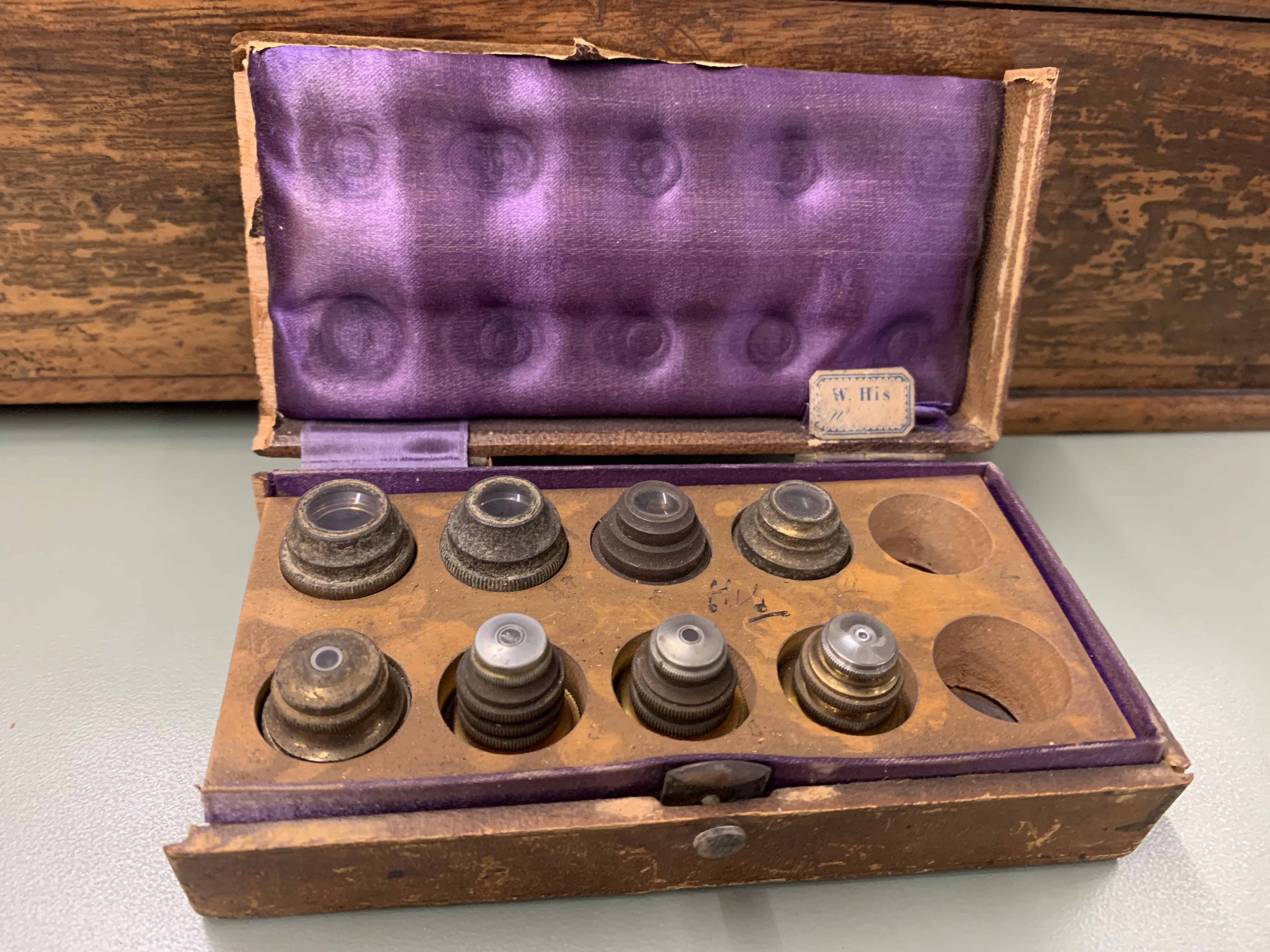 photo of objectives in lined wooden box