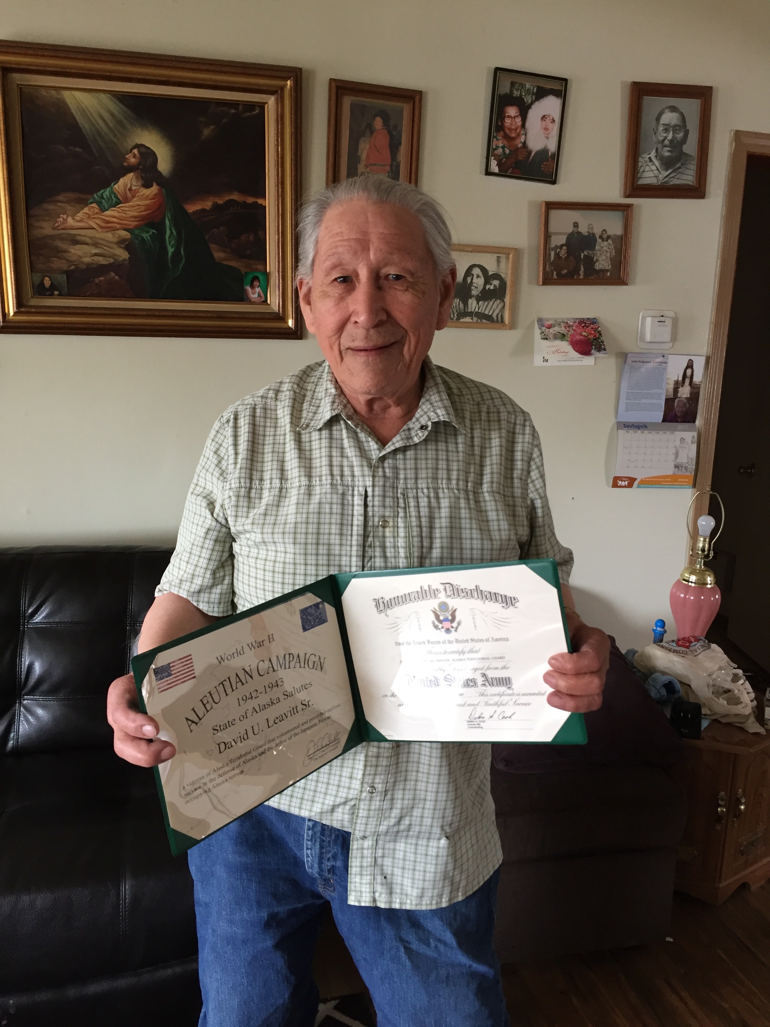 man holding certificate 