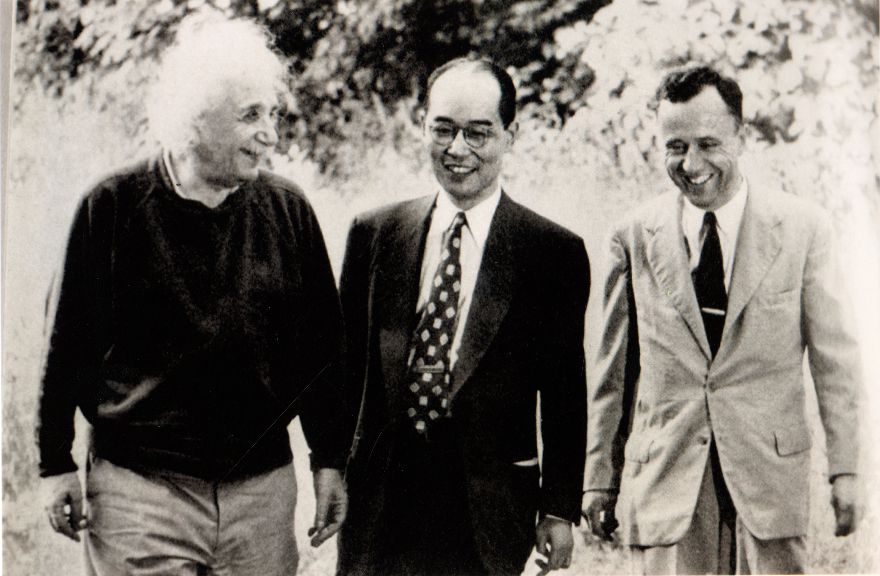 black and white photo of Einstein, left, Hideki Yukawa, middle, John Wheeler, right