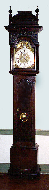 Arched face clockcase with Peter Stretch clock and brass-framed oculus