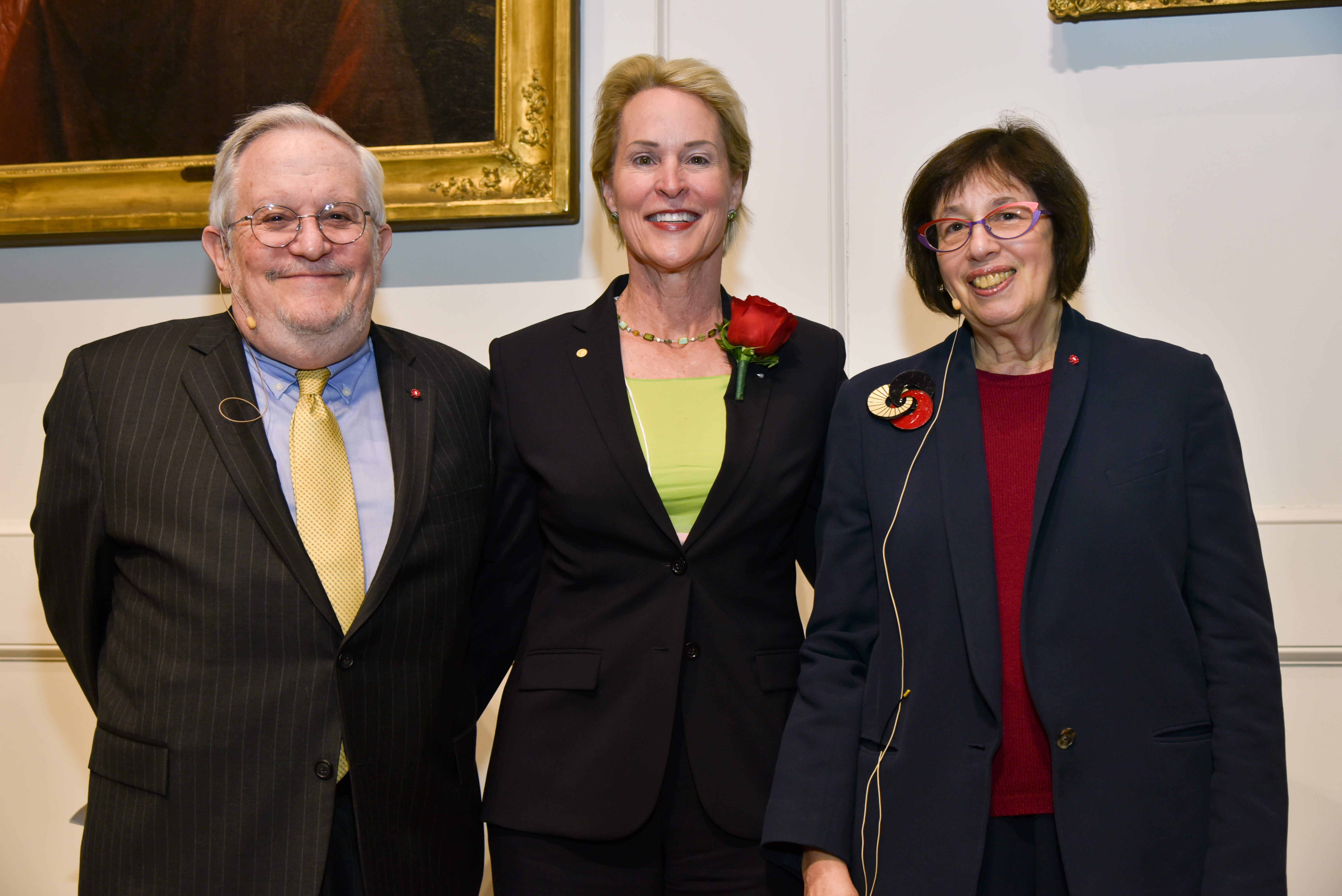 three people posing in group