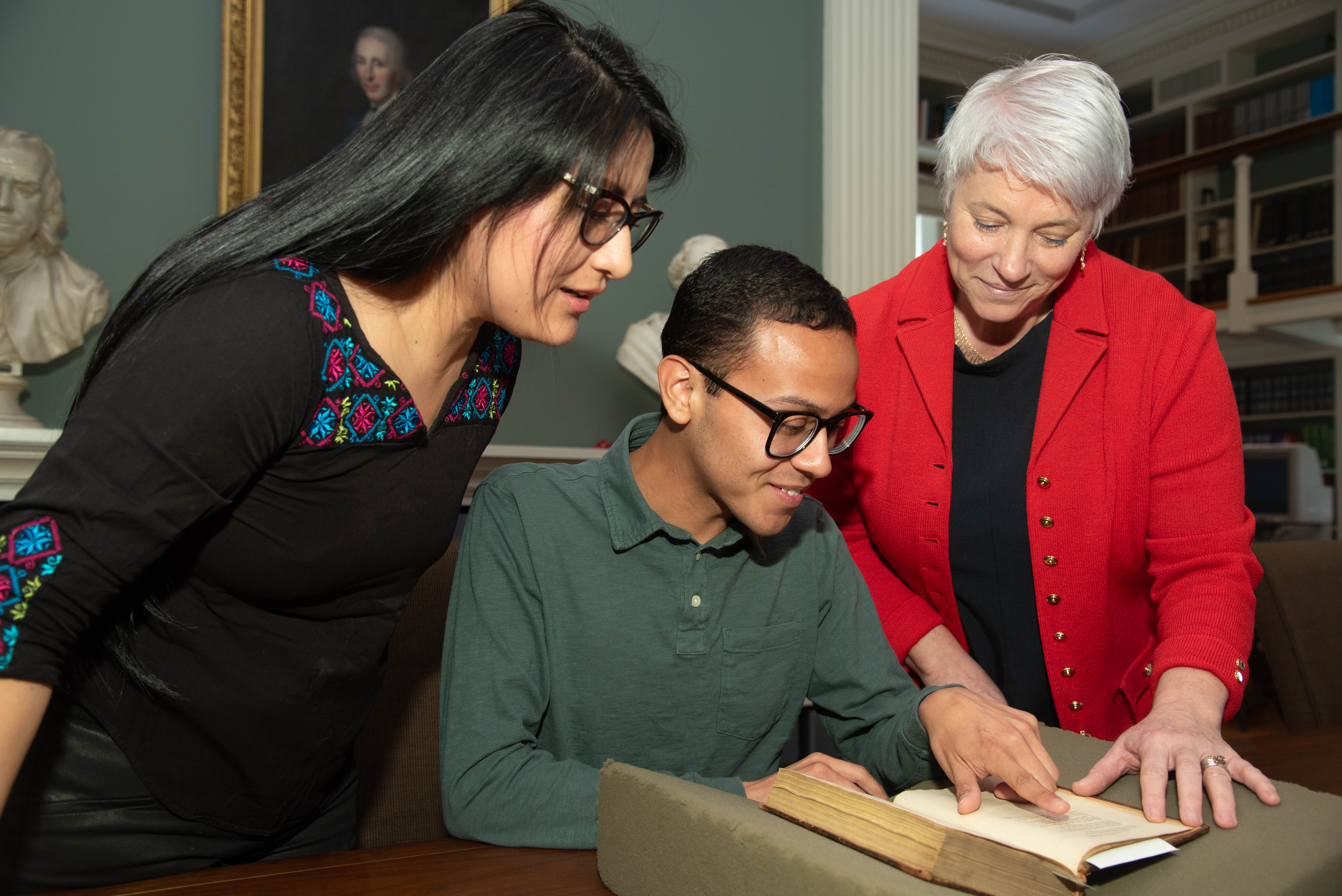 (Left to right) Alexandra Lamina, Michael Ortiz, Michelle McDonald (Director of APS Library and Museum) in the APS Reading Room, 2024
