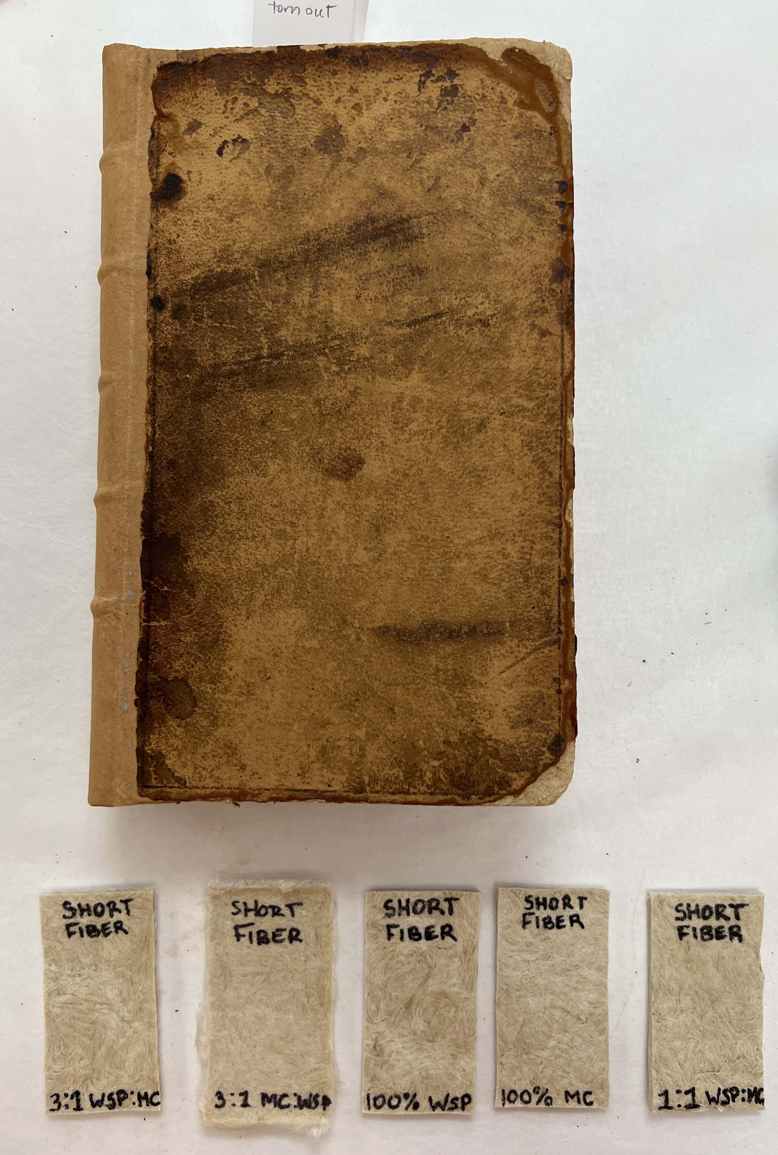 A worn leather book.