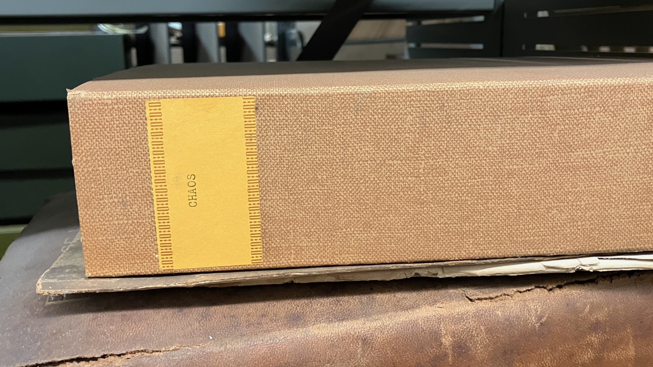 book box with yellow label "CHAOS"