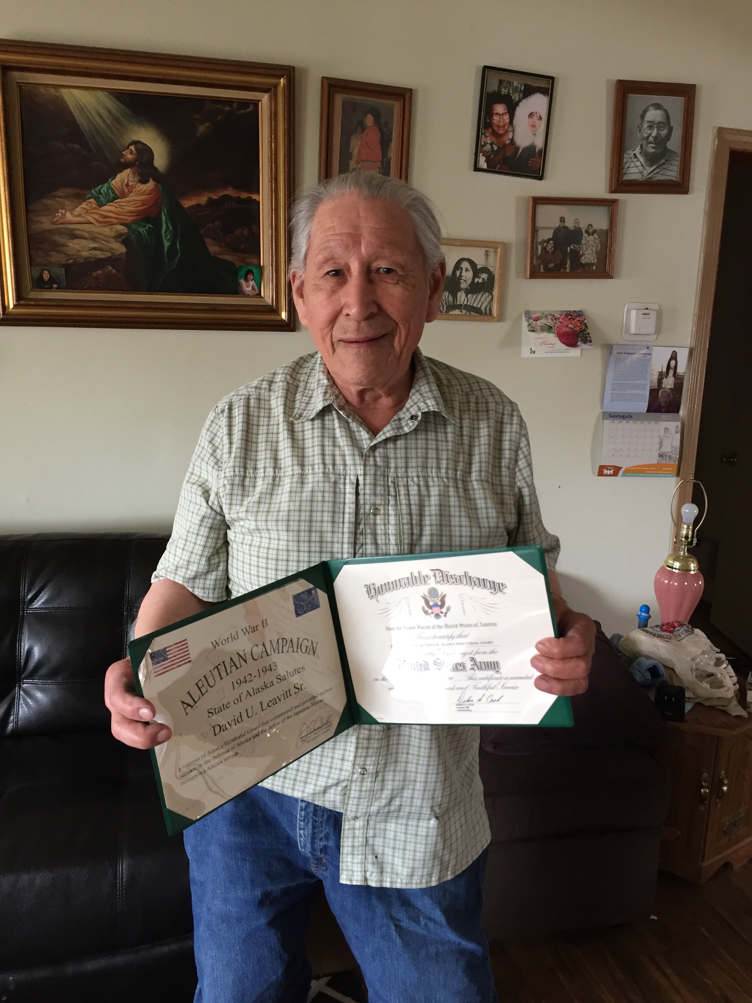 man holding certificate