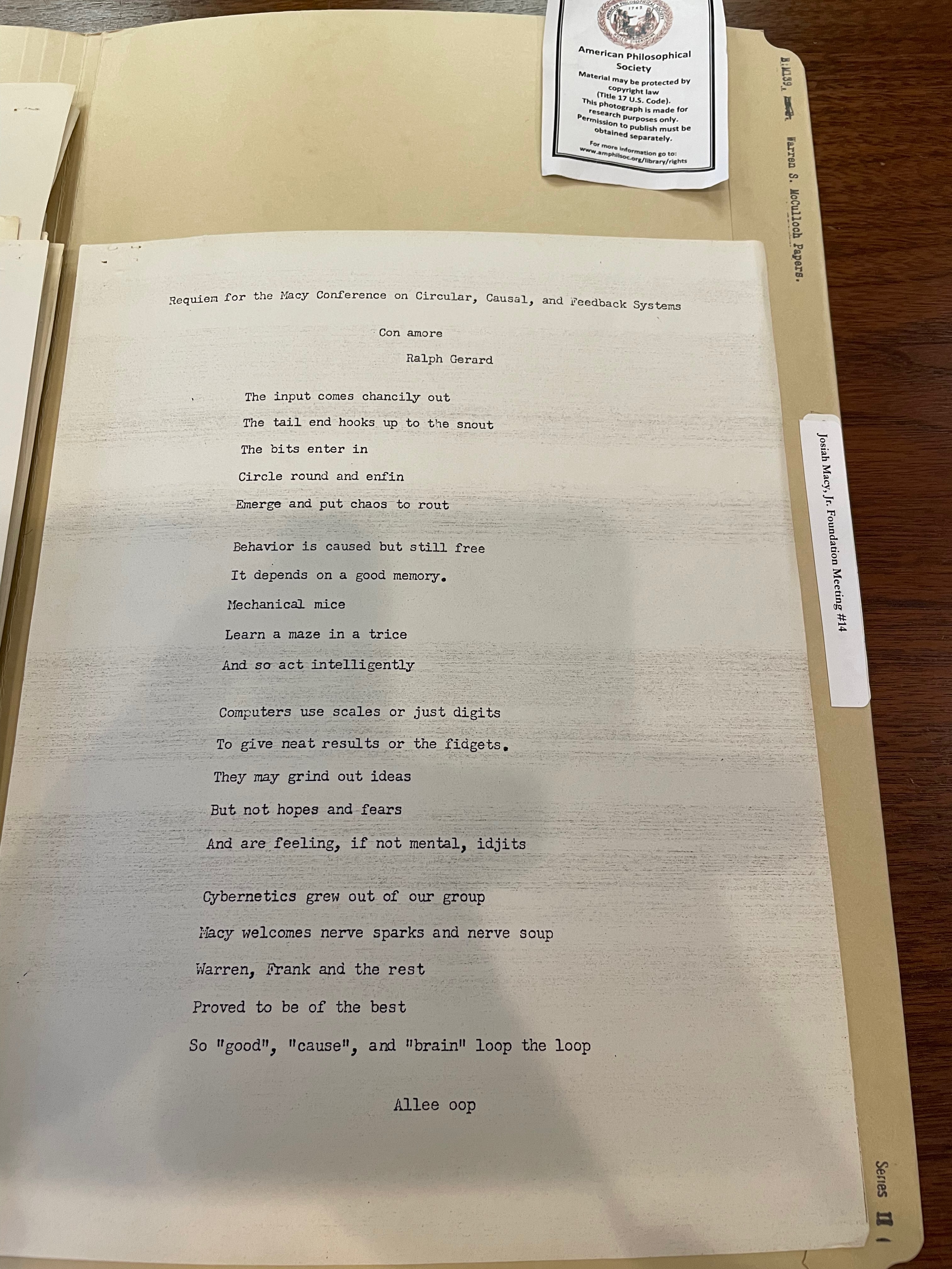 photo of typed manuscript page on folder