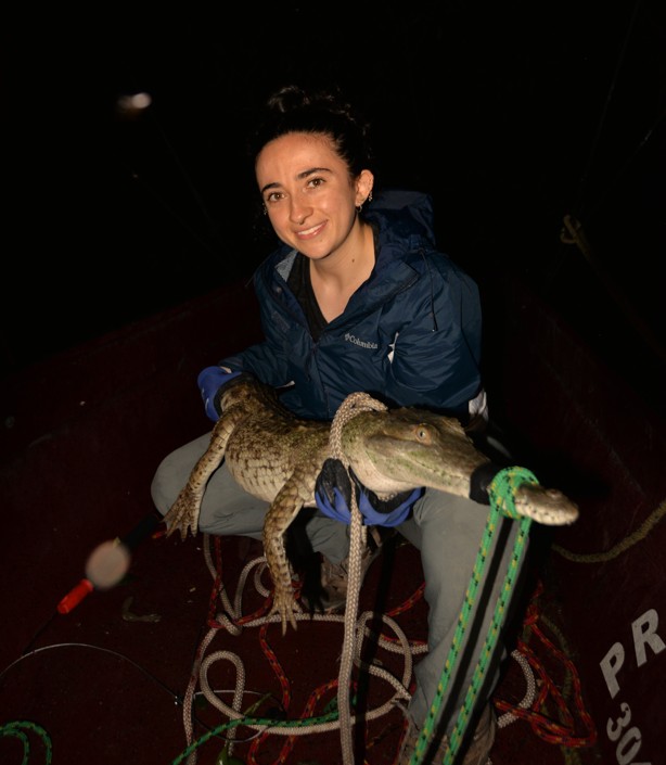 Lewis and Clark Field Scholar Ana Saldarriaga with a juvenile crocodile during an expedition in La Macarena, Colombia