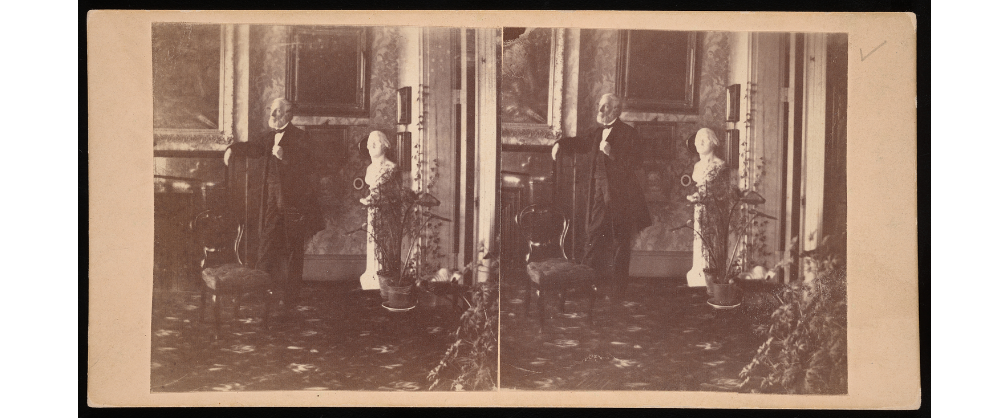 Two black and white photos of Titian Peale, posing with a chair and bust inside his home.