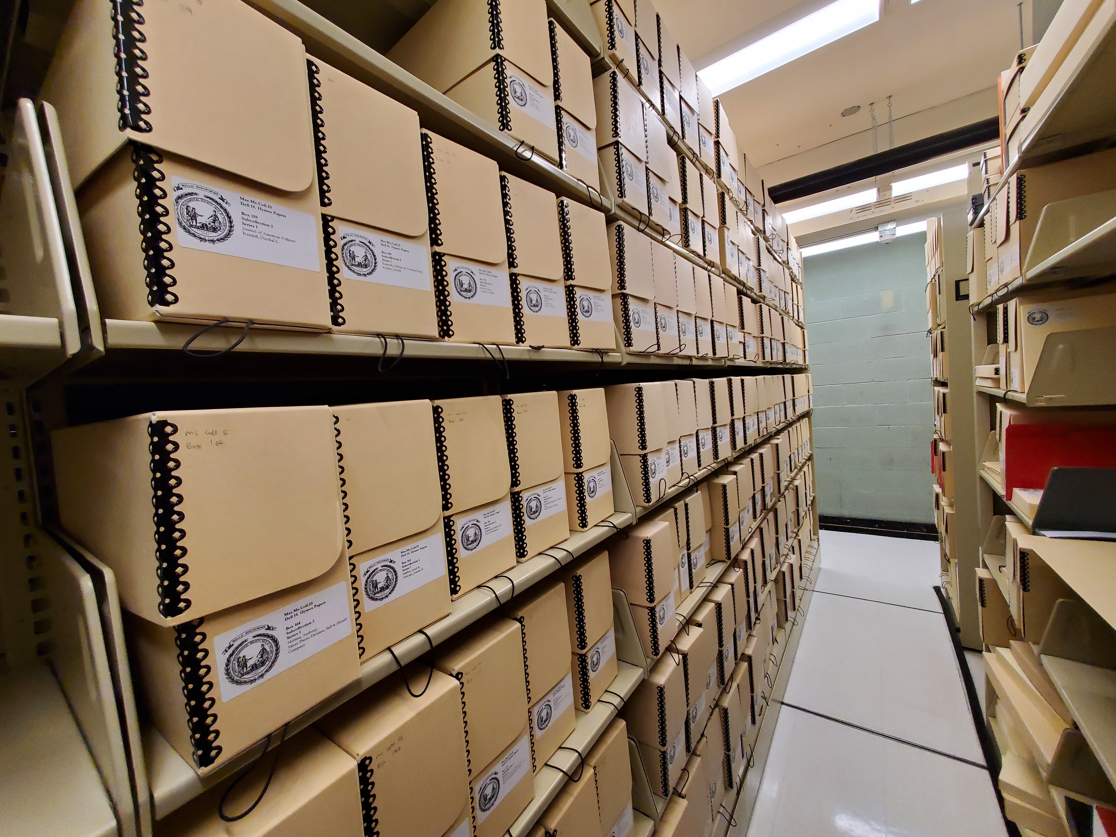 Archival boxes on library shelves