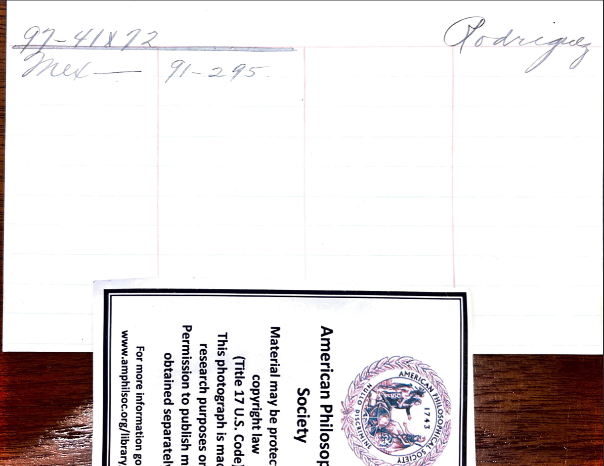 An index card with some writing on it. Description below.