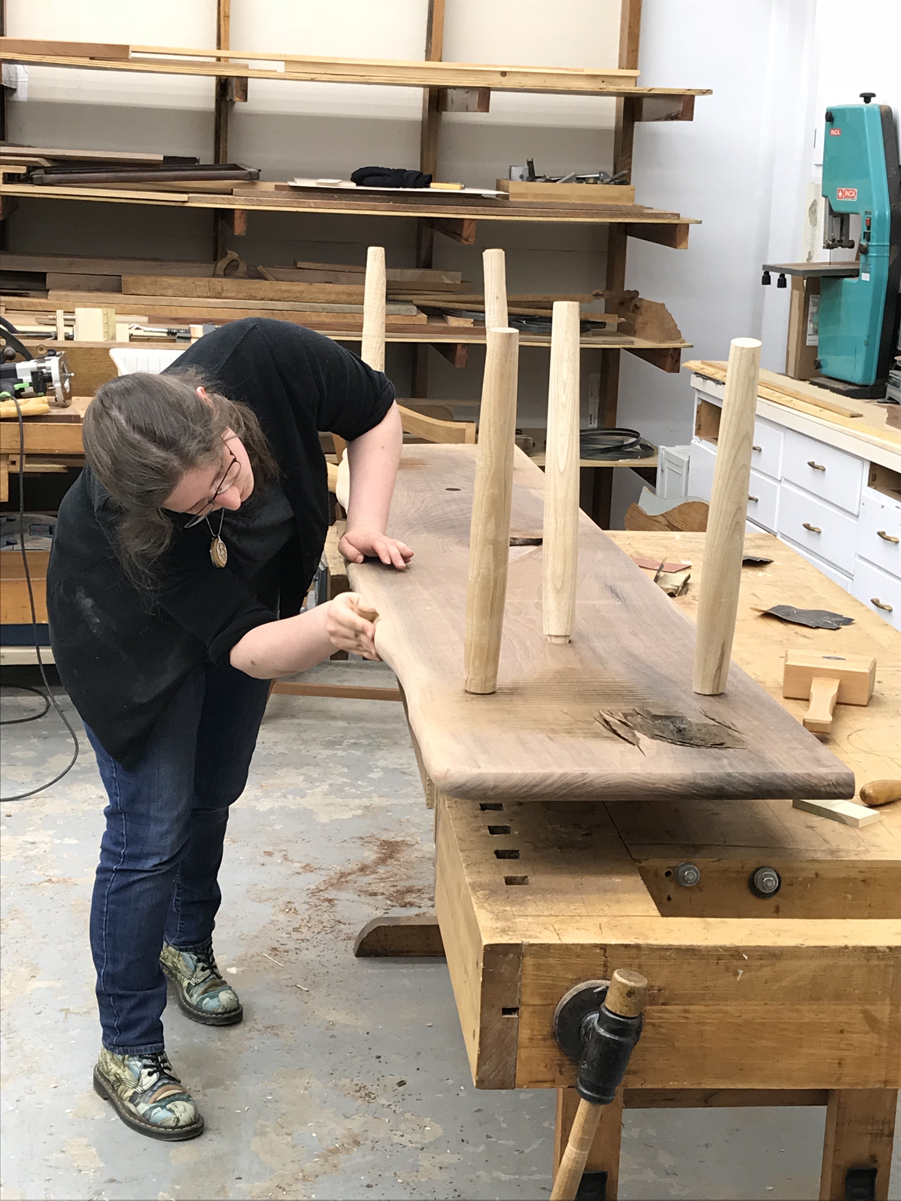 woman sanding bench