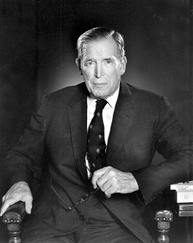 black and white photo of man seated