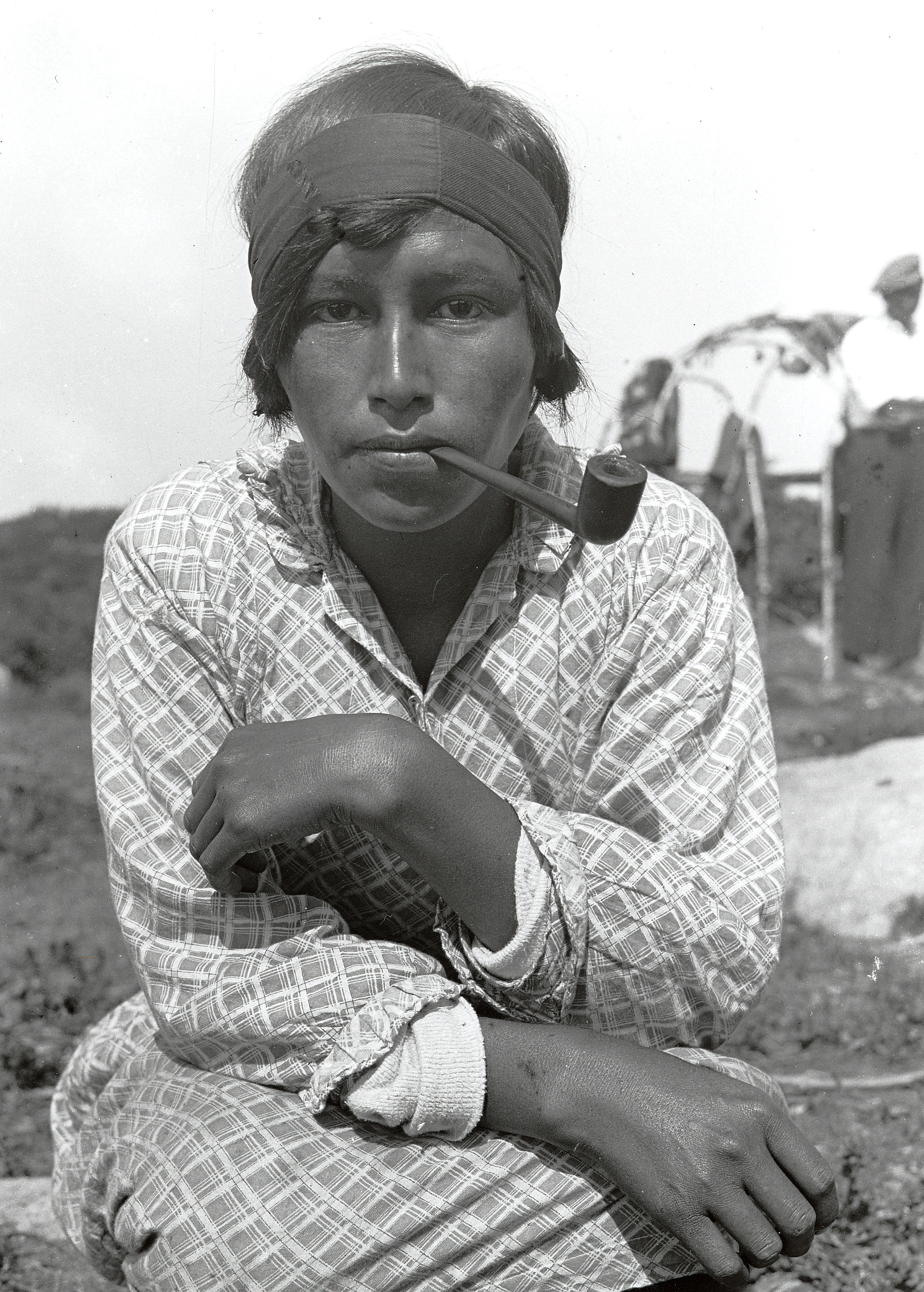 Native American woman with pipe