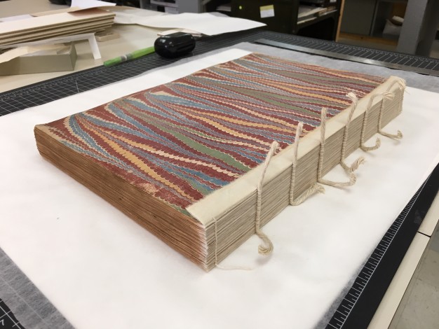 book with sewn spine exposed