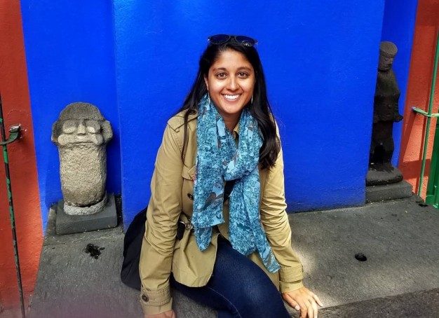 woman in front of blue background