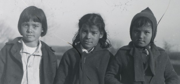 three children in black and white photo