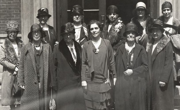 black and white photo of eleven women