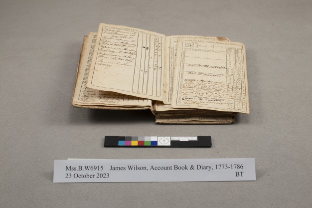photo of open book before conservation treatment
