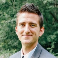 man in suit jacket with spiky hair