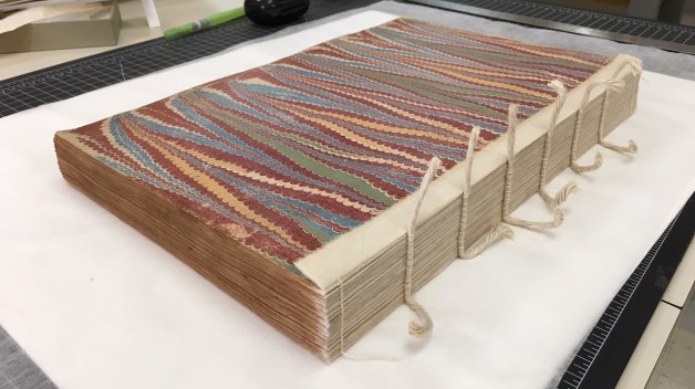 book with sewn spine exposed