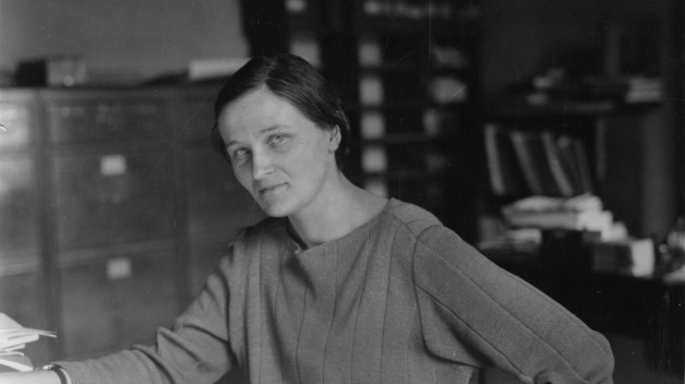 Image of a woman sitting at a table
