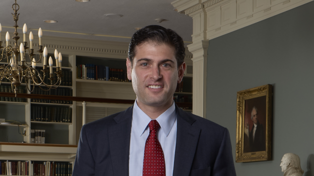 portrait of Patrick Spero, standing in APS Library reading room