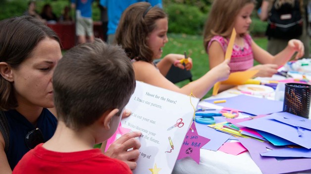 Families doing crafts in APS's Jefferson Garden 