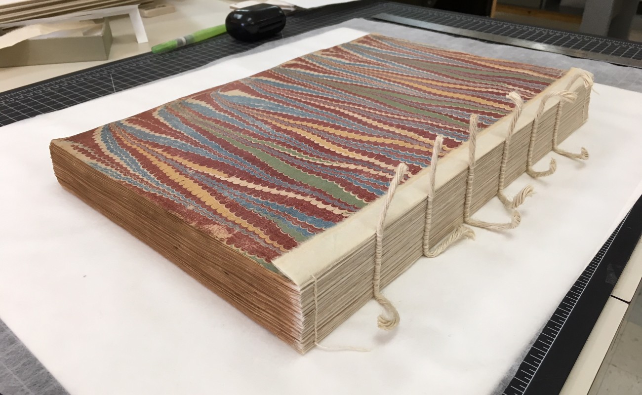 book with sewn spine exposed