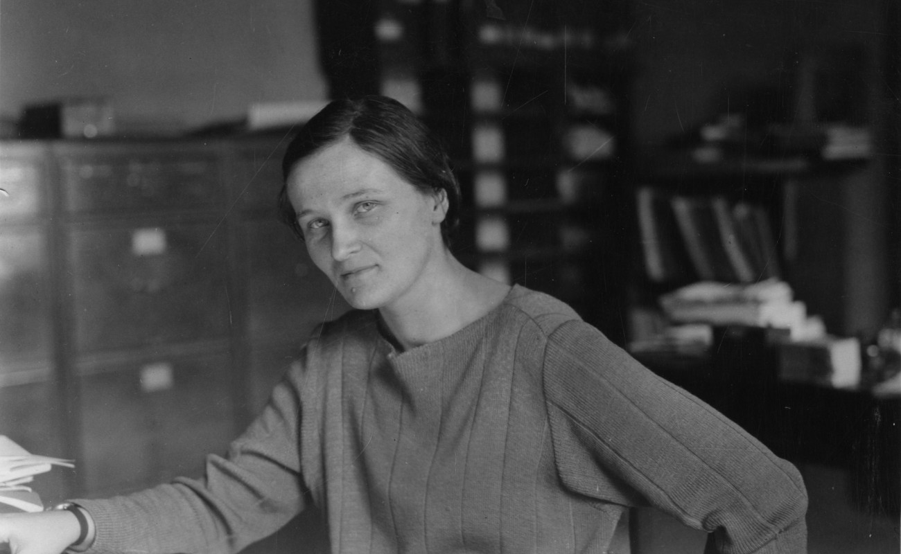 Image of a woman sitting at a table