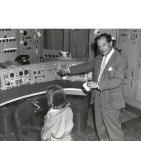 father and daughter at controls 