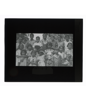 Black-and-white glass lantern slide of a group portrait of Creek children, Alabam.
