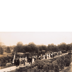 image of a gathering of people walking through a the New York botanical Garden