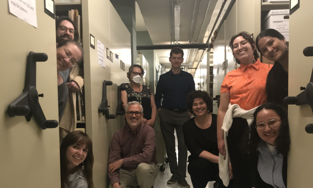 Photo of 2023 NASI interns, APS staff, and visitors inside the collections area