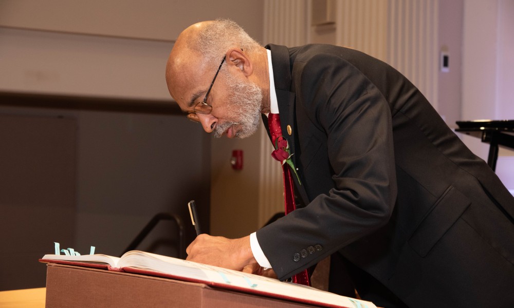 Emery Brown Signs APS Member Roll Book