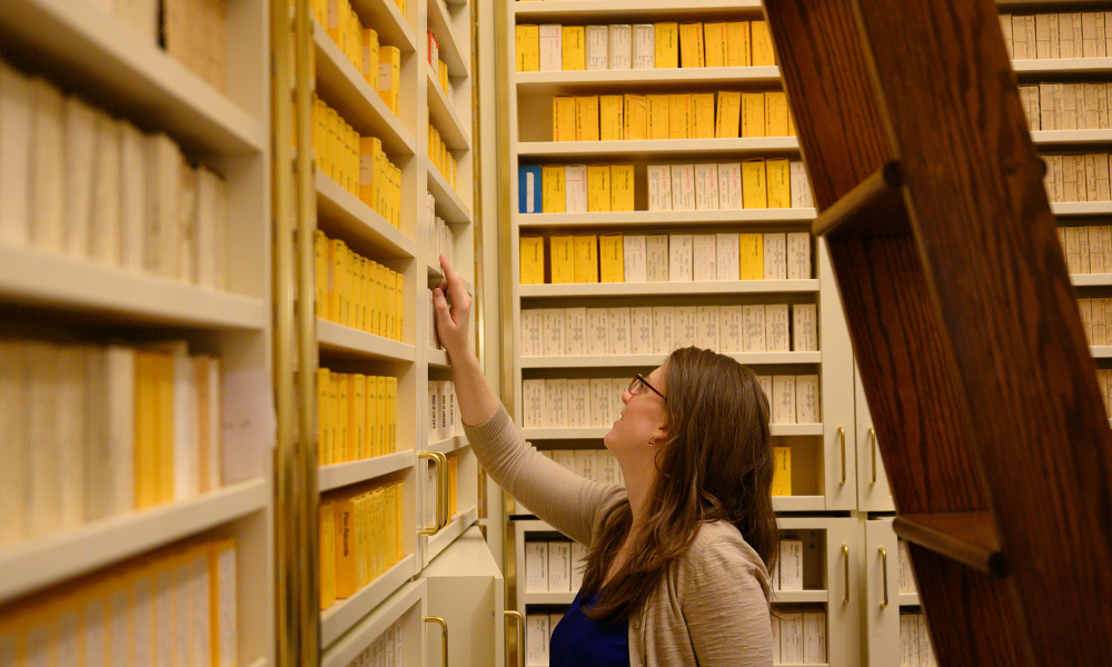 reseacher in microfilm stacks