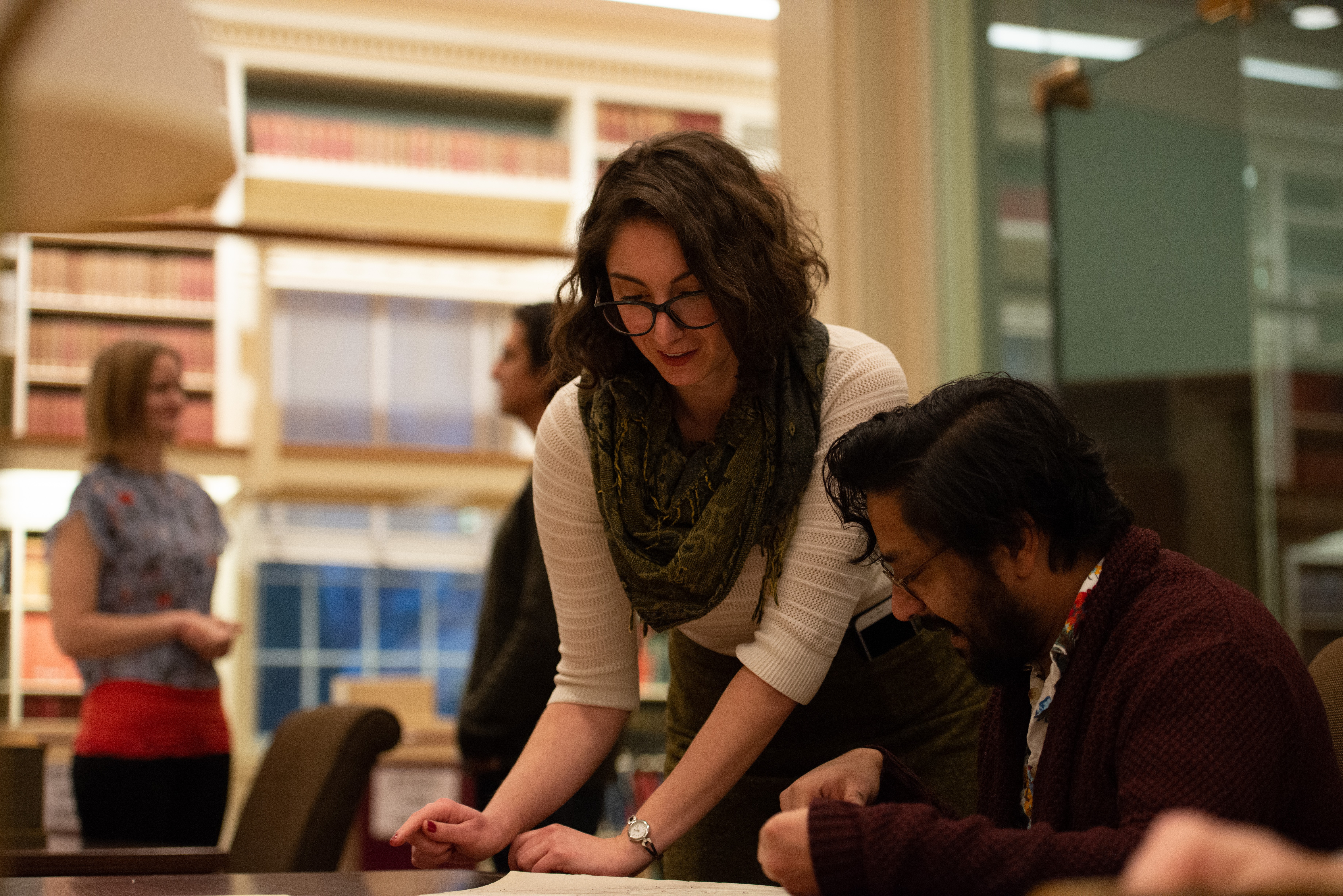 Woman helping a researcher in the Reading Room