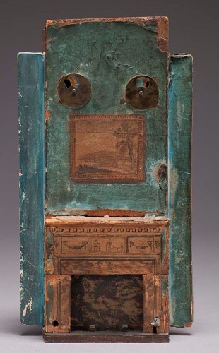model of a fireplace painted green with decoration