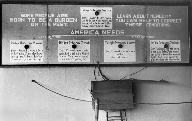 black and white photograph of flashing light sign