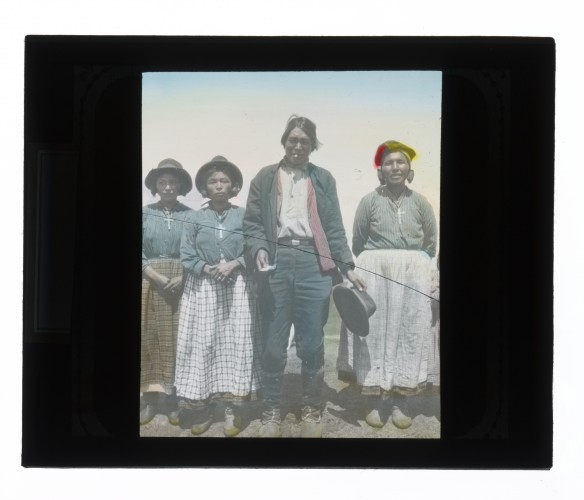 Hand-colored glass lantern slide portrait of a Montagnais-Naskapi family.